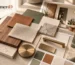Interior material board with wood, stone, fabric, metal, and finish samples.